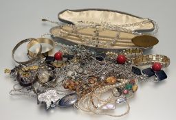 A collection of costume jewellery to include a triple paste pearl graduated necklace, a gilt metal