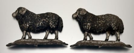 A pair of cast-iron painted ram formed door stops. (h-19.5cm l-26cm) (2)