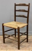 An Arts and Crafts side chair, in the style of Morris & Co, ash frame with ladder-back and woven