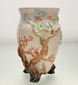 A Clarice Cliff for Newport Pottery, India Tree style three footed vase, marked verso. (h-19.5cm)