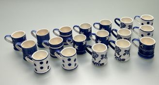 A mixed collection of eighteen Whittard espresso cups in original boxes, decorated with stylized