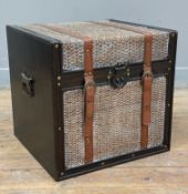 A modern storage trunk, woven top and hardwood frame, faux-leather straps and storage to interior: