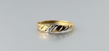 A 9ct gold scroll ring set a diamond point O 1.02g