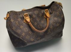 Louis Vuitton, a Fleur de Jais tan monogram coated canvas Speedy handbag with cowhide vachetta trim,