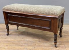 An Edwardian mahogany piano stool, upholstered hinged top in green floral fabric, enclosing