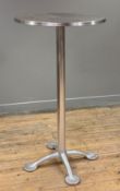A modern steel bar table, in the style of Jorge Pensi, circular stainless-steel top raised on column