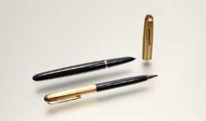 A Parker 51 slate grey acrylic and gilt fountain pen with matching propelling pencil in orginal case