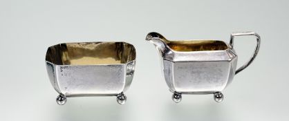 A late Victorian silver gilt individual octagonal panel-sided sugar dish: h. x 3.5cm l. x 6,5cm w. x