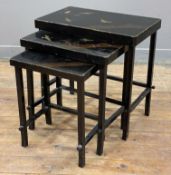A modern Chinese lacquer-style nest of tables, with birds and floral decoration to top raised on