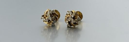 A pair of 9ct gold stud scroll earrings set nine diamond points: d. x 0.5cm 2.95g