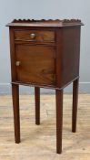 A 19th century mahogany bedside cabinet, scalloped ledge back over frieze drawer, cupboard door to