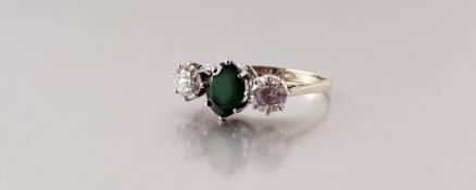 A 9ct gold ring set oval emerald coloured stone approximately 0.5ct flanked by a cubic zirconia to