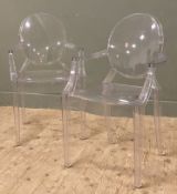 A pair of Kartell Louis Ghost chairs, designed by Philippe Starck, oval backs and open arms in