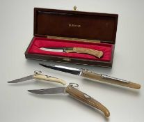 A collection of folding knives, comprising a graduated trio of French Fait-Main J. Mongin Inox