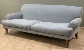A modern three-seater sofa by Sofa.com, rolled back and arms upholstered in soft blue linen/