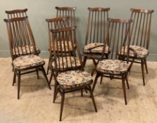 A set of eight Ercol Goldsmith dining chairs, six plus two carvers, spindle backs and cushion seats,