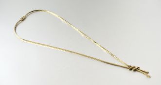 A 9ct gold box link cross over style necklace set two diamond points to knot with a clip