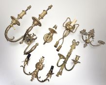 A collection of various decorative gilt painted wall scones comprising, a bow-tie twisted rope