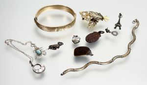 A collection of costume jewellery to include a 9ct gold-plated engraved stiff hinged bangle: d. x