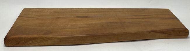 A large asymmetric beech wood chopping/charcuterie board, marked 2019 to side (79cm x w. 31cm)