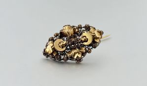 A continental yellow metal filigree panel brooch with original pin: l. x 3cm 2.63g