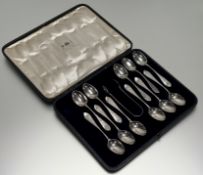 An Edward VII London silver set of eleven engraved tea spoons: l. x 13cm and pair of matching