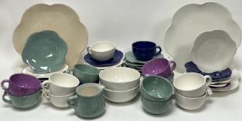 A mixed collection of handpainted Maryse Boxer part tea and dinner service ware in mottled green,