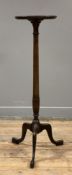 A George III-style mahogany jardiniere, circular top raised on turned column and tripod supports: H.