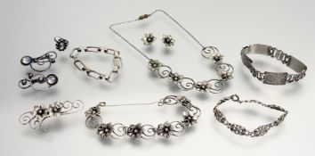 A collection of continental white metal jewellery in the Scandinavian taste with flower head and