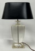 A Mid--Century lucite table lamp of urn form with chrome fittings, complete with an oval form