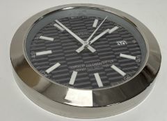 A dealer-display clock styled after a Rolex 