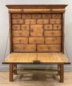 A George II oak secretaire, circa 1750, moulded cornice over parquetry inlaid fall-front,