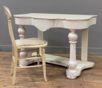 A painted pine console table, serpentine front over frieze drawer, raised on baluster supports to
