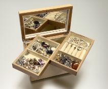A pine jewellery box containing a collection of costume jewellery to include three marcasite