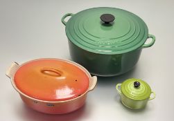 A collection of Le Creuset cookware comprising, a bamboo green Cast-Iron Cassrole Dish (h-19cm w-