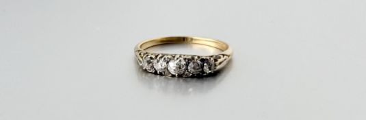 A 18ct gold ring set five old mine cut diamonds center stone approximately 0.20ct with five rose