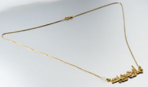 A 18ct gold eastern script pendant: l. x 4cm on 18ct gold fine box link chain necklace with ring