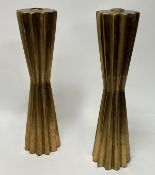A pair of gilded resin candlesticks of hourglass form with scalloped edges (h. 41cm) (2)