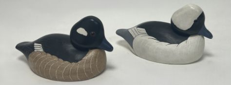 A pair of carved Wildflower Decoys wooden carved ducks, Babylon N.Y, modelled as a Bufflehead hen