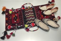 A 20th century Persian saddle bag, decorated in polychrome geometric and zig-zag design
