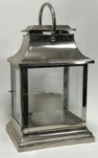 A rectangular chrome and glazed lantern with stepped base and loop handle to top (h. incl handle