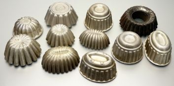 A collection of various misc aluminum jelly moulds. (tallest h-10cm smallest h-7cm) (9)