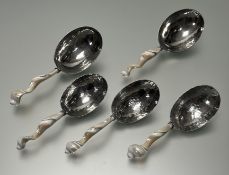A collection of five hammered stainless steel with twisted shell handles (l. largest 22cm) (5)