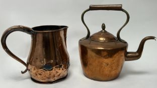 A 19thc hand-crafted hammered copper jug complete with a large rounded handle (h. 22cm), together