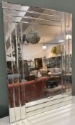 A modern frameless rectangular hall mirror, with cut edge border (74cm x 105.5cm) (a/f)