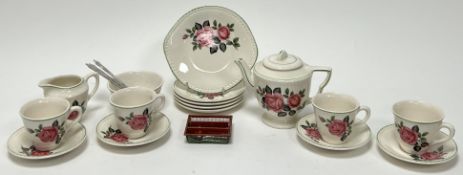 A Biltons Children's part tea service decorated with roses on a cream ground with green border,