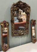 A plaster and mixed media wall sconce with mirror plate in the Rococo style with foliage motifs