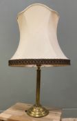 A brass column table lamp, with bell-shaped shade raised on fluted column and circular base: H.
