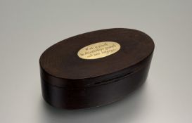 A William IV yew wood oval desk/ table snuff box with yellow metal mounted top, inscribed Take a