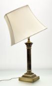 A late 19thc brass corinthian column table lamp, raised on a square stepped plinth base together